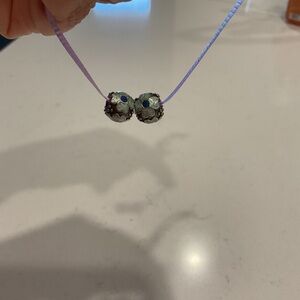 Two Pandora flower charms